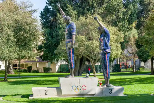 What did U.S. sprinters Tommie Smith and John Carlos protest during the 1968 Mexico City Olympics? 